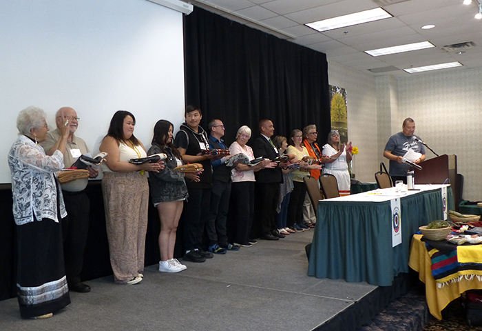 Indigenous peoples of many ages on stage at the National Indigenous Spiritual Gathering 2023