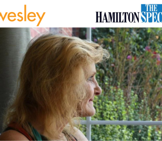 Sue, a client at the Wesley care unit, looks out a window