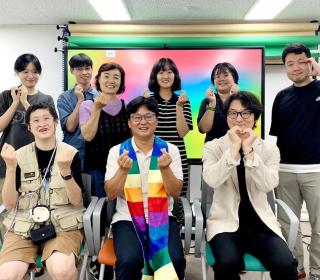 Rev. Lee and church members supporting LGBTQAI+ inclusion in the Korean church.