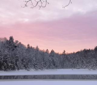 A lake partially covered by ice in winter