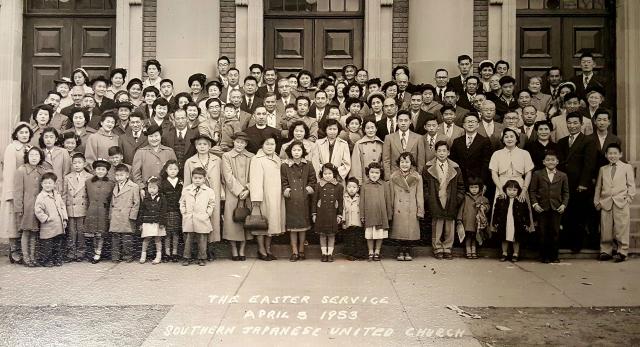 A large photo of the congregation of Southern Japanese United Church, Easter 1953, gathered on the steps of the church. Everyone is dressed in suits and dresses for the occasion.