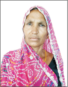 Headshot of Maina Bai, an Indian woman, in a pattern pink sari.