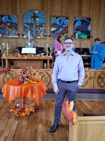 Horacio Mesones in front of a church altar