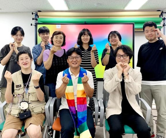 Rev. Lee and church members supporting LGBTQAI+ inclusion in the Korean church.