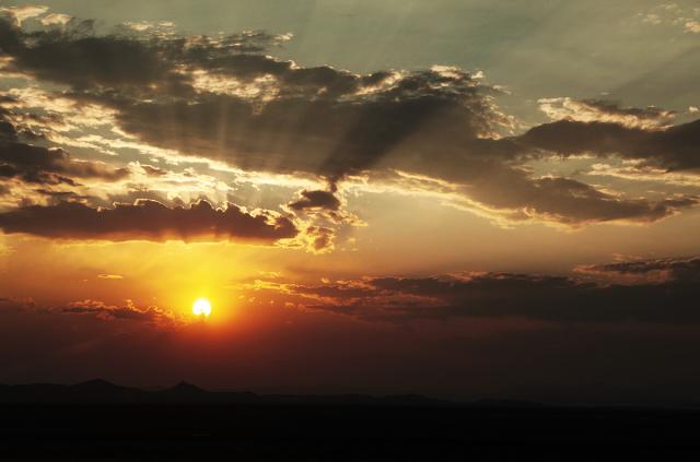 The sun bursting through the clouds.