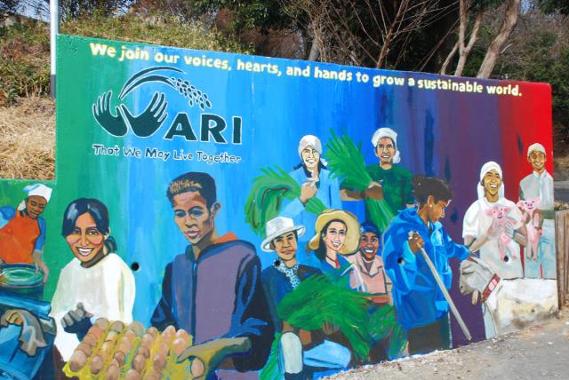 A colourful mural at the Asian Rural Institute depicting its motto “That we may live together.”