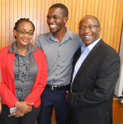 Three members of Pembizo Christian Council, Africa smiling.