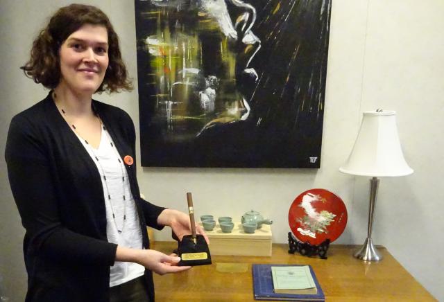 General Council Archivist Nichole Vonk shows off the fountain pen used to sign The Basis of Union, in front of the desk used for that pivotal event in 1925. 