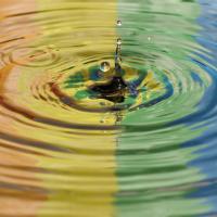 Rainbow reflected in water